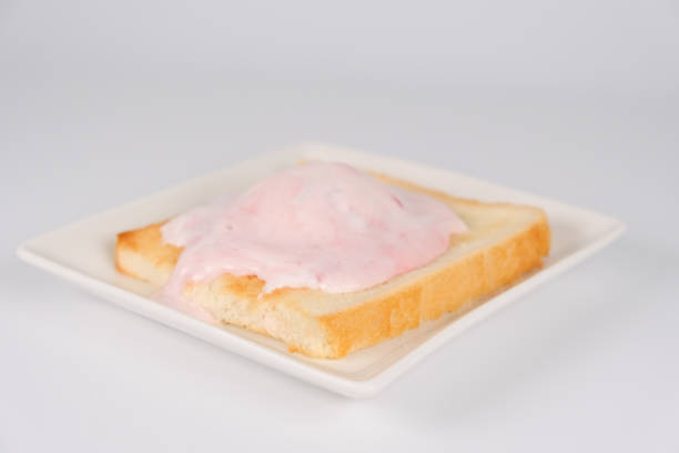 slice of bread , toast , orange, butter