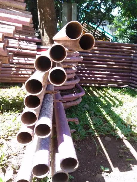 pile of long pink pipe cavities in front of the house terrace