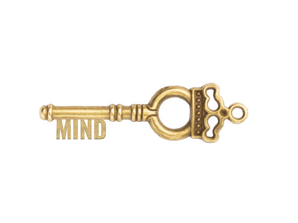 istock Bronze vintage antique keys with word Mind isolated on white background 1377186639