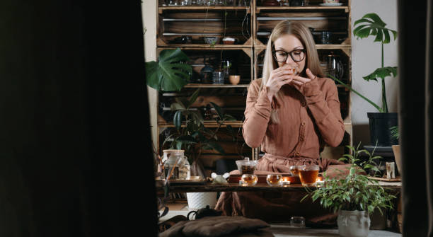 istock Women preparing tea ceremony in cafe in small cups 1377189313