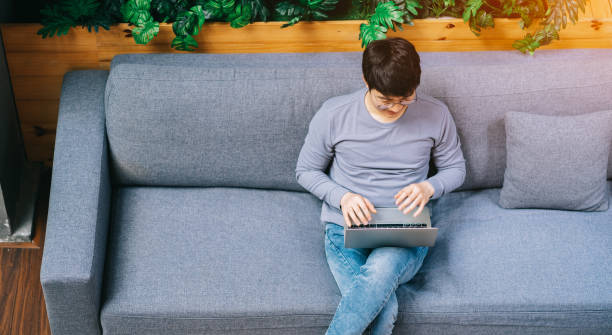 istock Young Asian businessman at home 1377223885