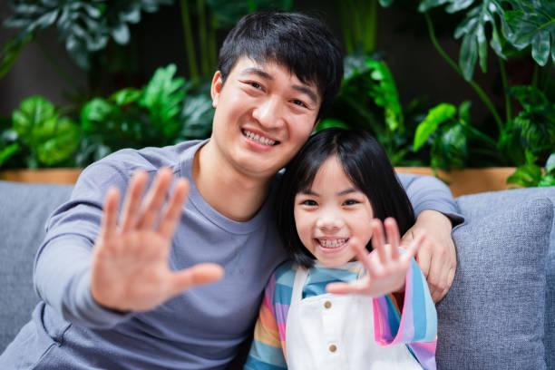 istock Asian father and daughter at home 1377224428