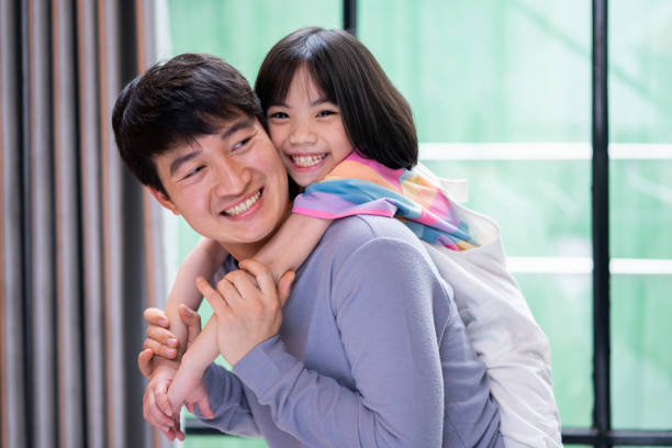 istock Asian father and daughter at home 1377224765