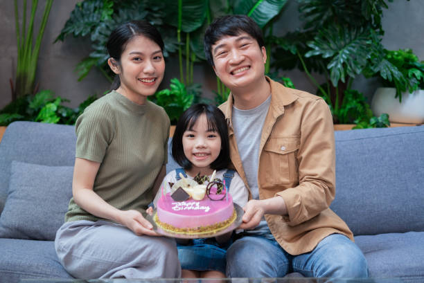 istock Young Asian couple celebrates their daughter's birthday 1377231333