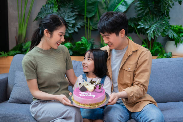 istock Young Asian couple celebrates their daughter's birthday 1377231337