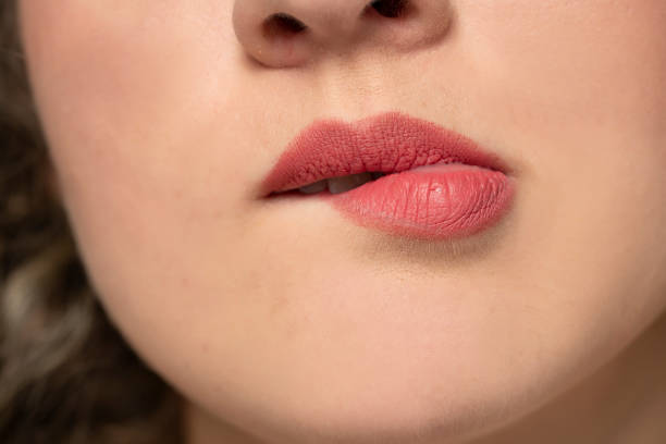 istock woman biting her lip 1377271747