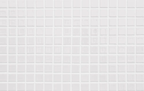 istock White or gray ceramic wall and floor tiles abstract background. Design geometric mosaic texture decoration of the bedroom. Simple seamless pattern for backdrop hospital wall, canteen and grid paper. 1377277529