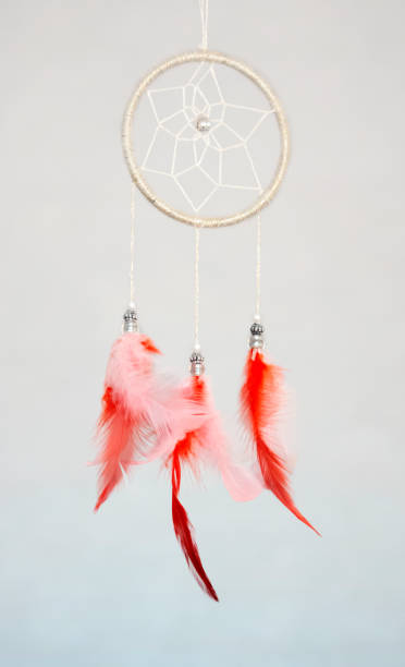 istock Handmade dream catcher with feathers and hanging rope beads 1377290287