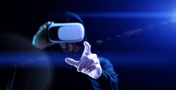 istock Vr goggles virtual reality. Young man in digital helmet for 3d virtual reality game on dark background. Study and virtual world in 3D simulation. 1377297734