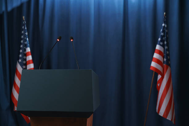 istock A scene for debates with a pedestal and American flags from both sides 1377315913
