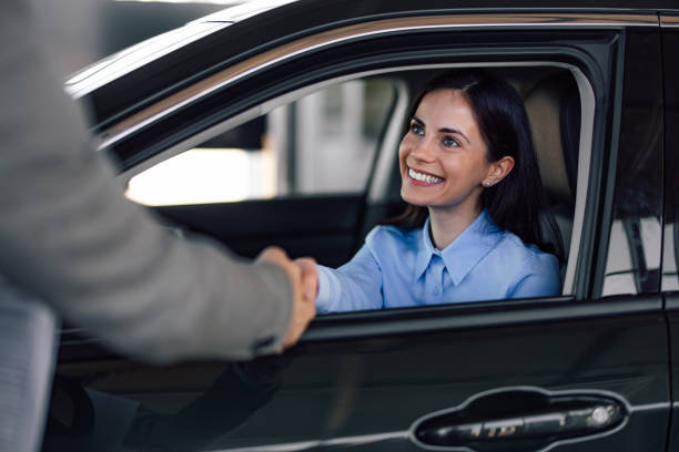 istock Cheerful woman, shaking hands with company stuff. 1377316606