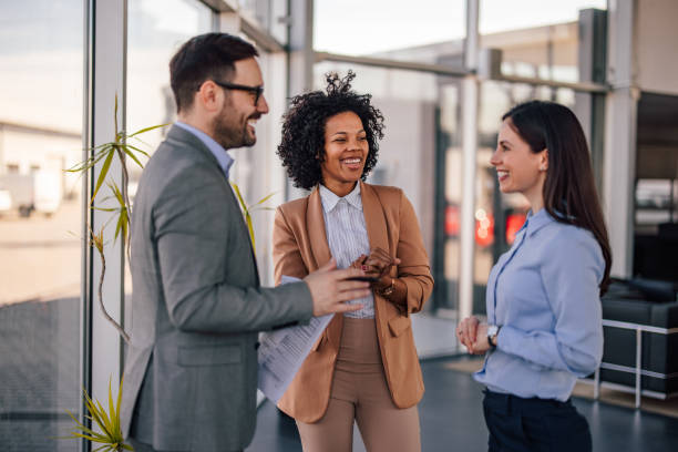 istock Smiling diverse colleagues, discussing their company protocols. 1377319955