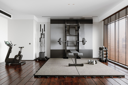 Personal Training Studio With Barbell, Dumbbells, Exercise Bike And Other Sports Equipments