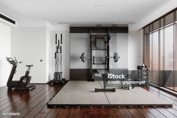 Personal Training Studio With Barbell Dumbbells Exercise Bike And Other Sports Equipments Stock Photo - Download Image Now
