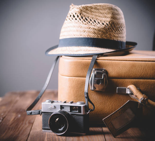 istock Vintage case and retro photo camera. Traveling concept. 1377340023
