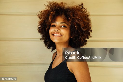 istock Beautiful afro woman with perfect make-up outdoors 1377355010