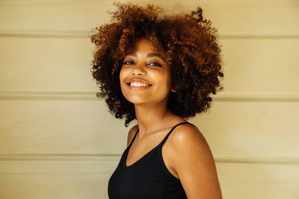 Beautiful afro woman with perfect make-up outdoors Beautiful afro woman with perfect make-up outdoors curly hair stock pictures, royalty-free photos & images