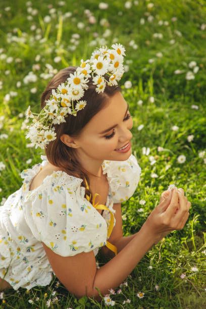 istock Beautiful woman lying on the grass 1377359250