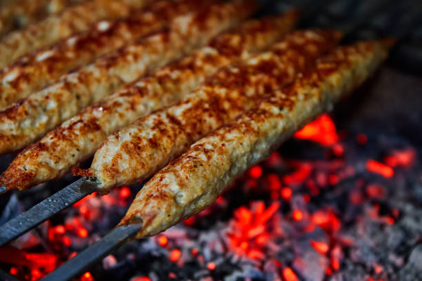Lula kebab grilled on charcoal. Close-up, selective focus.