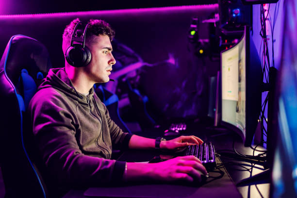 istock A focused gamer playing online game on modern computer at gaming room. 1377390229