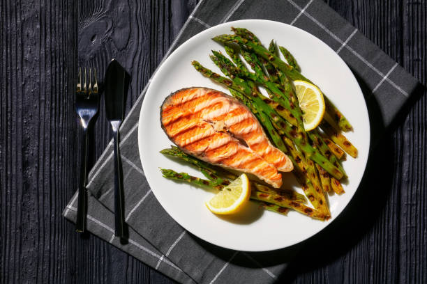grilled salmon steak with asparagus and lemon