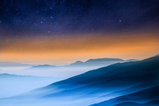 istock Starry sky over misty mountains. Beauty in nature. 1377408632