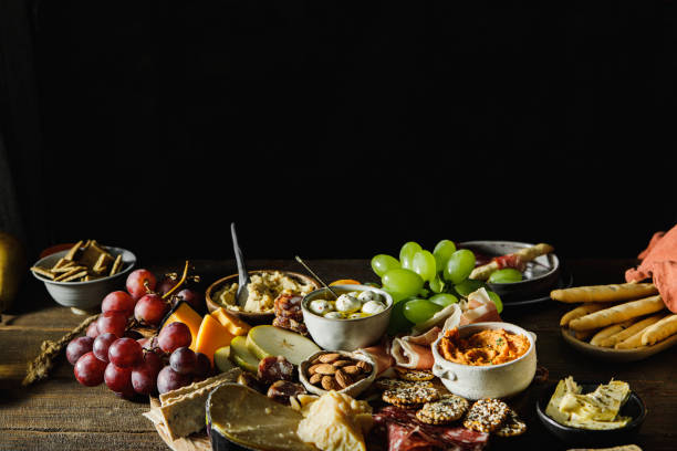 istock Cheese and meat platter served on wooden table 1377409091