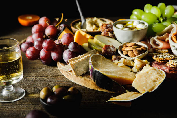 istock Cheese and meat platter served on wooden table 1377409096