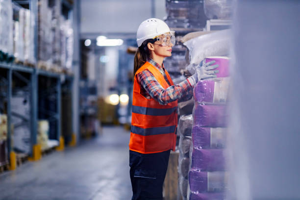 istock A female storage worker relocating sacks with flour and preparing it for shipping. 1377413044