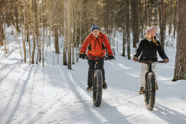 istock Father and daughter fatbiking in nature 1377422947