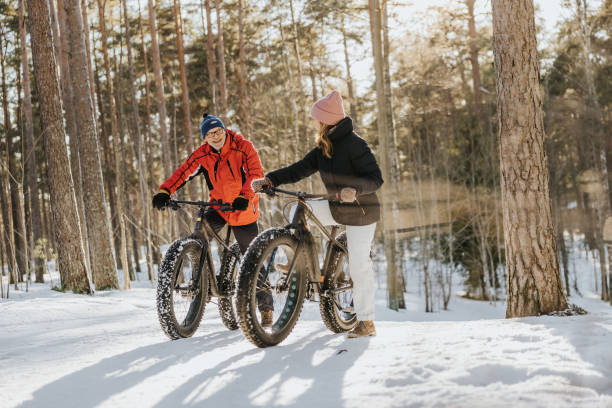istock Father and daughter fatbiking in nature 1377422948