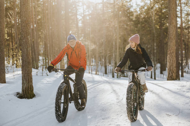istock Father and daughter fatbiking in nature 1377422951