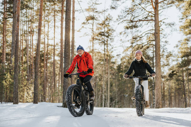 istock Father and daughter fatbiking in nature 1377422953