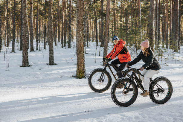 istock Father and daughter fatbiking in nature 1377422962