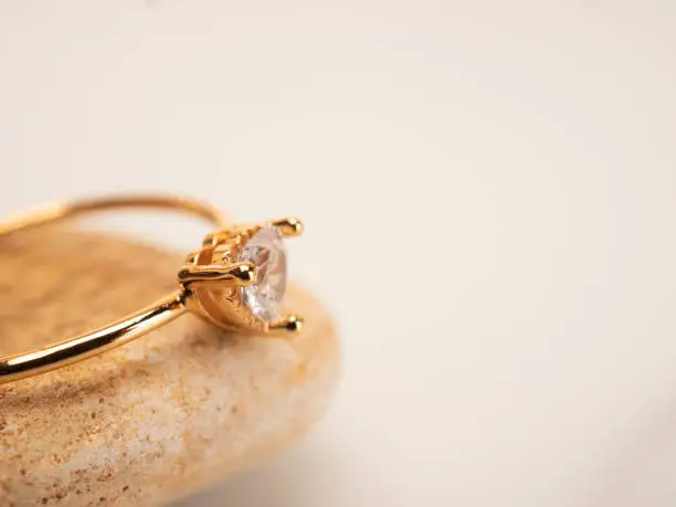 Close up shoot of gold wedding ring with beautiful diamond