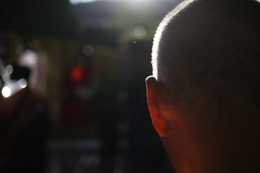 An Asian senior man's bald head.