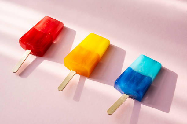 istock Colored popsicles against multicolores explosion paint. Various bright ice cream. Summer concept. 1377434031