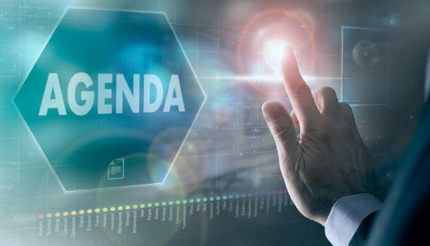 istock A businessman controlling a futuristic display with a Agenda concept on it. 1377450977