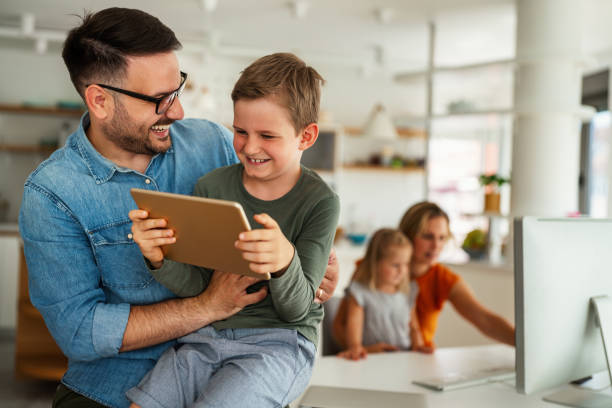 istock Distance learning, online education, home work concept. Family with digital devices at home. 1377456939