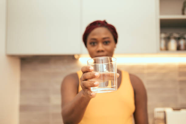 istock black woman with water 1377461348