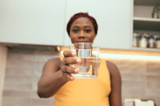 black woman with water stock photo