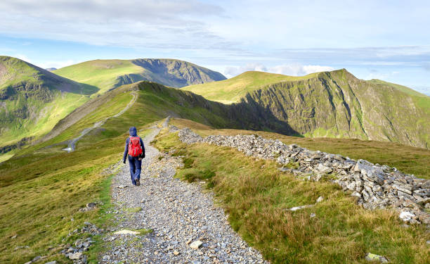 istock A hiker walking along a stone chip path along a mountain ridge 1377466666