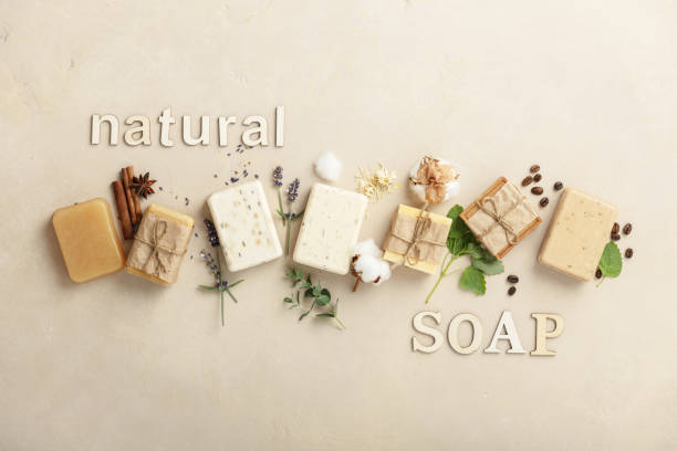 istock Handmade organic soap bars and ingredients on natural stone background, flat lay 1377470957