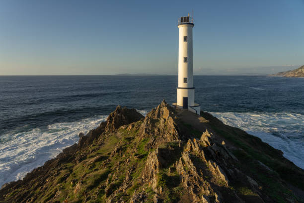 istock Cabo (cape) Home lighthouse on the cliffs at sunset in Rias Baixas zone in Galicia coast. 1377476847
