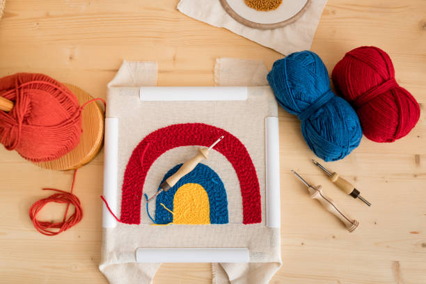 Top view of set tools and woolen threads for embroidery punch needle work. Handmade, handicraft, hobby, diy concept