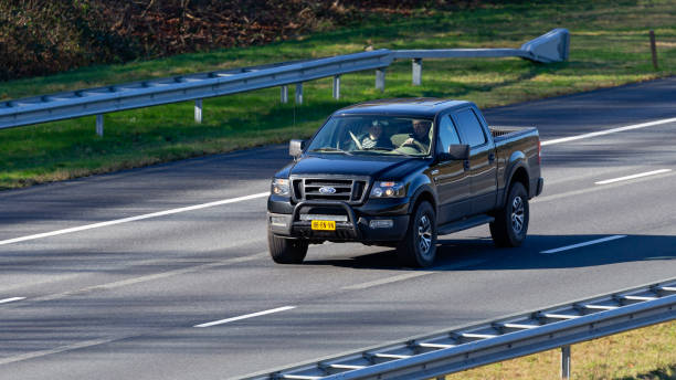 Dutch 2004 Ford F 150 pick-up driving on the A1 highway Rijssen, Overijssel, Netherlands, february 23rd 2022, Dutch 2004 Ford 11th generation F 150 pick-up truck driving on the Dutch A1 highway at Rijssen - the F-series is a series of trucks made by American, Dearborn, Michigan based car manufacturer Ford Motor Company since 1948

The A1 is a 157 km long highway that crosses the country from West (Amsterdam) to East (Germany) 2004 2004 stock pictures, royalty-free photos & images
