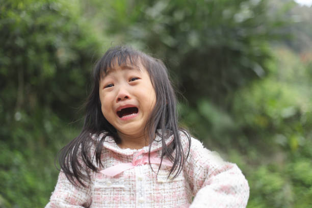 istock a Asian girl is crying. 1377554232