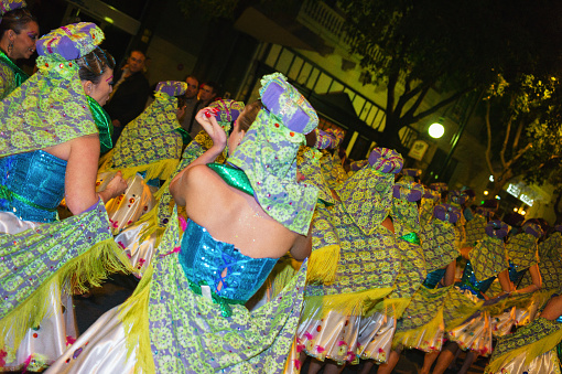 Nassau, Bahamas – December 26, 2022: The men in a traditional costume during a Junkanoo parade in the Bahamas.