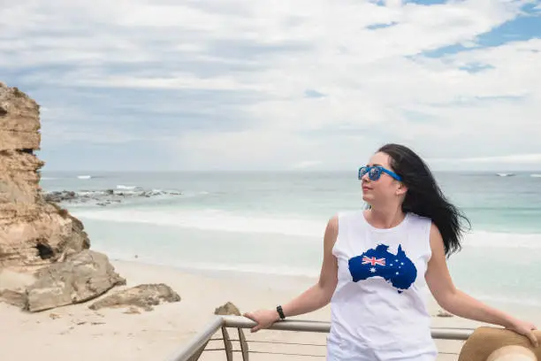 Young woman enjoyng the view at Kangaroo Island on Australia Day, South Australia
