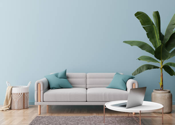 istock Empty light blue wall in modern living room. Mock up interior in contemporary, scandinavian style. Free, copy space for picture, poster, text, or another design. Sofa, plant, table. 3D rendering. 1377602190
